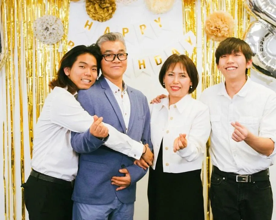 Young with his family at a birthday celebration.